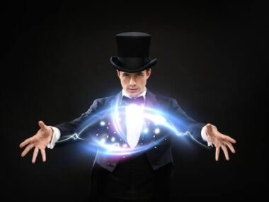 Magic, performance, circus, show concept - magician in top hat showing trick