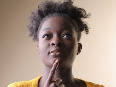 African American female thinking with her finger on her chin