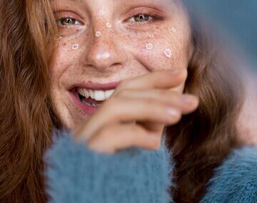 Smiley woman with white flowers on her face