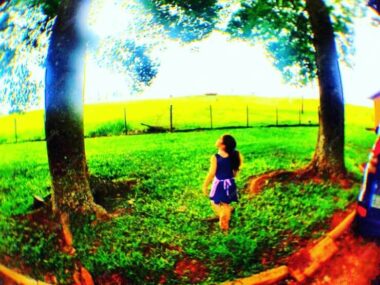 Woman standing on grassy field