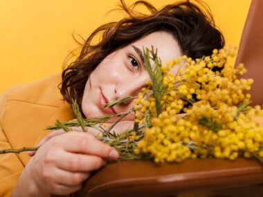 Close-up woman with flowers branches