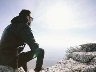 Man sitting on rock