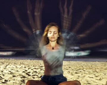 Young woman meditates. long exposure