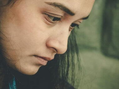 Close-up portrait of a woman looking away