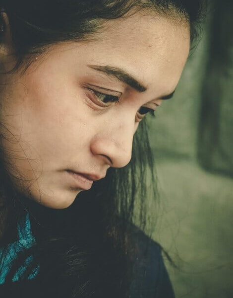 Close-up portrait of a woman looking away