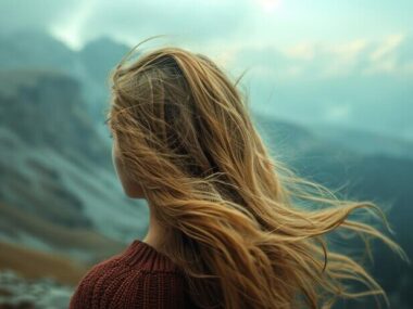 conceptual-image-capturing-girls-closeup-mountains-her-hair-gently-blowing-mountain-winds-against-picturesque-backdrop-generative-ai