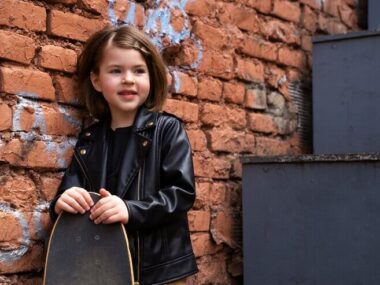 Medium shot girl holding skateboard