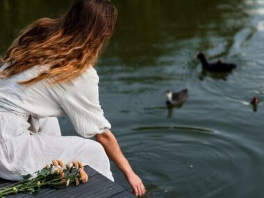 Medium shot woman by the lake