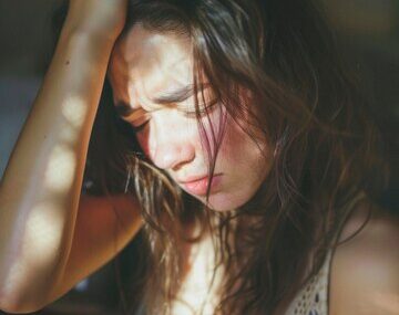 Portrait of teenager suffering from hangover