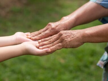 Grandmother and granddaughter holding hands