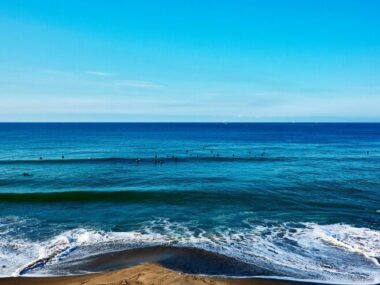 Scenic view of sea against blue sky