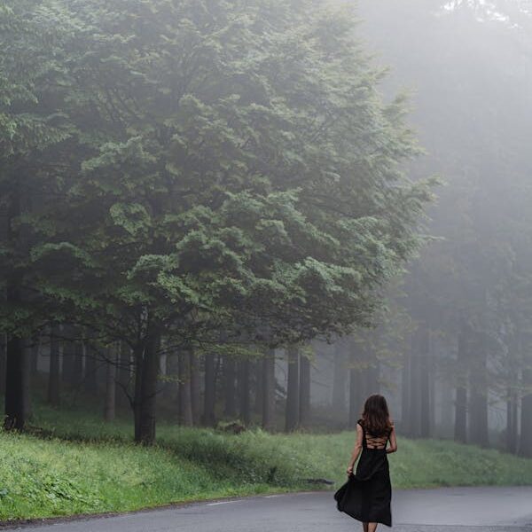 A girls walking on Misty path