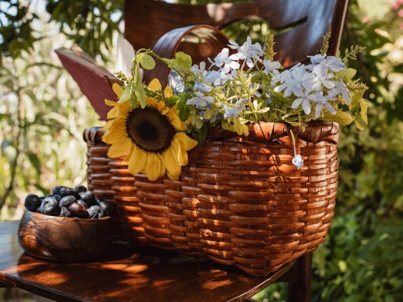 Picnic Basket with Flowers on Table