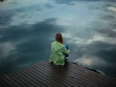 Woman Sitting on Wooden Planks