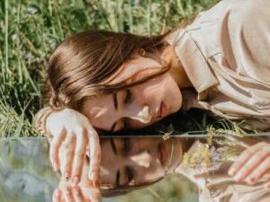 Photo of Woman Laying on the Grass