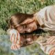 Photo of Woman Laying on the Grass