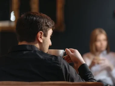 Man Drinking from a Cup