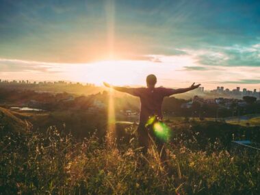 Person Spreading Hands Against Sun