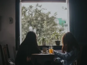 Two girl view outside the window