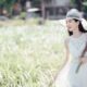 Positive ethnic woman enjoying nature in rural environment